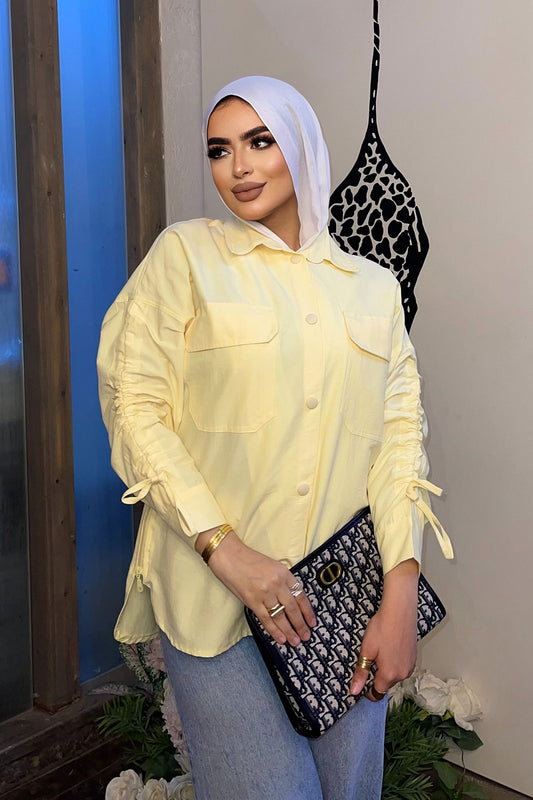 Shirt with chest pocket and long sleeves with drawstring and zipper on the sides